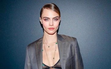 "Breaking All Conventional Fashion Rules: English Model Rocks Charcoal Grey Pant Suit with Emerald Studded Tiered Necklace" - Cara Delevingne