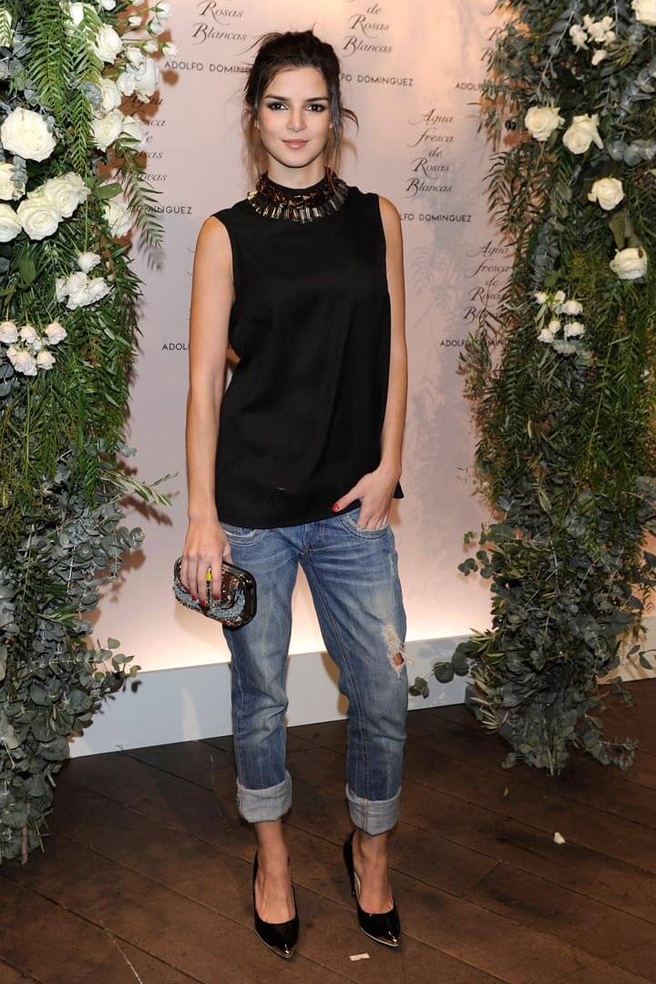 Clara Lago In Black Sleeveless Long Top With Blue Damage Jeans