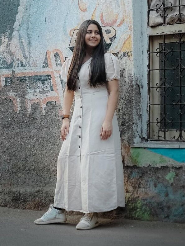 Cute Palak Jain Flaunting Her Curves In Off White Long Dress With Casual Shoes
