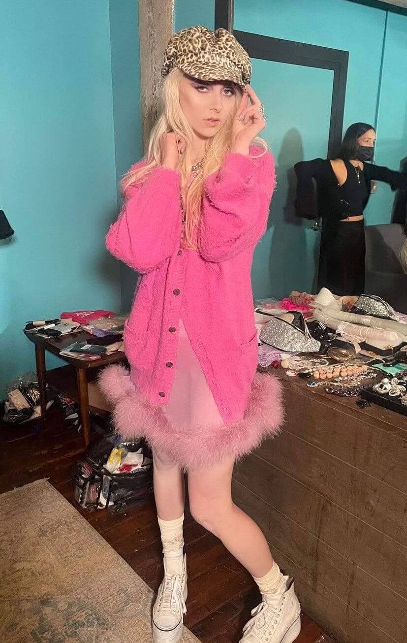 Gorgeous Taylor Momsen in a baby pink mini dress and pink jacket