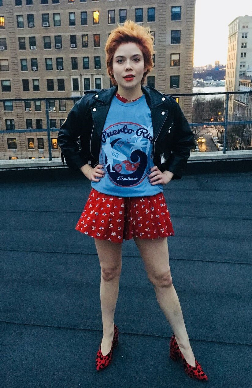 Gracie Gillam In Blue T- Shirt & Red  Mini Pants With  Black Jacket