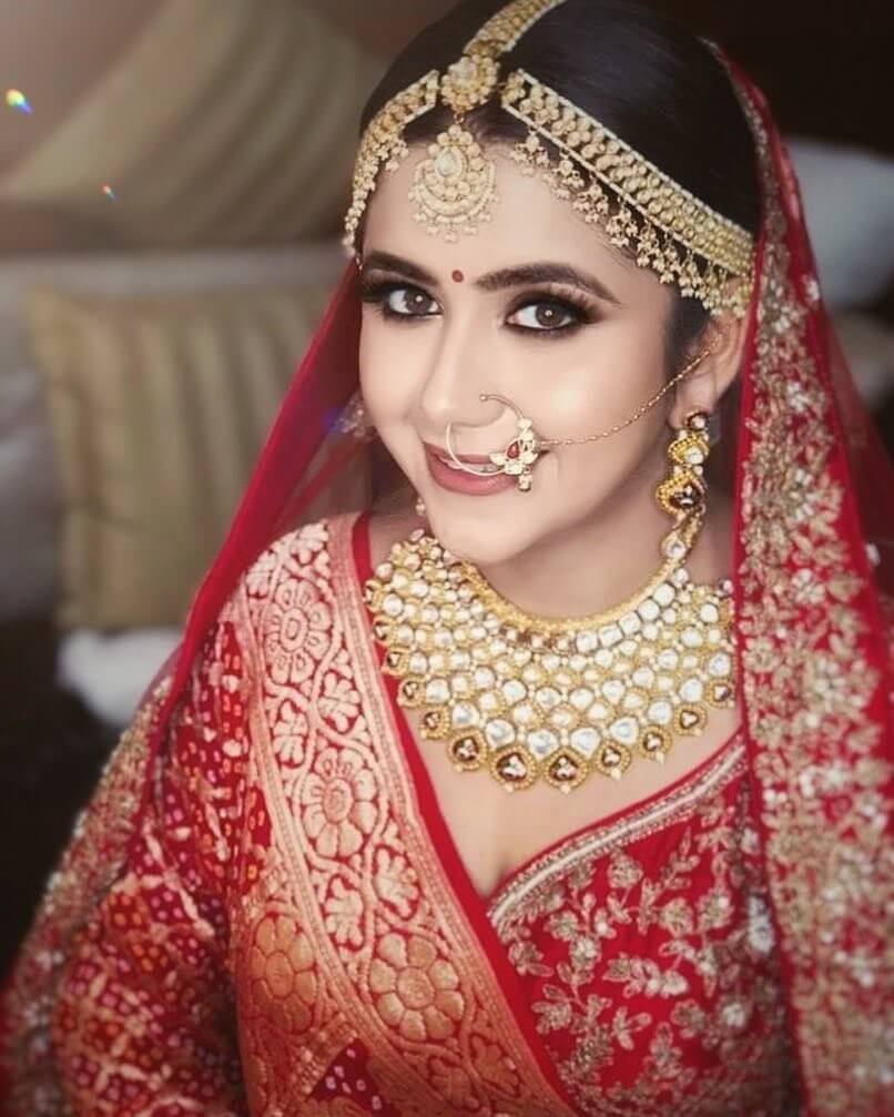 Palak Jain In Royal Red Bridal Wear Donning With Exclusive Kundan Jewellery On Her Big Day