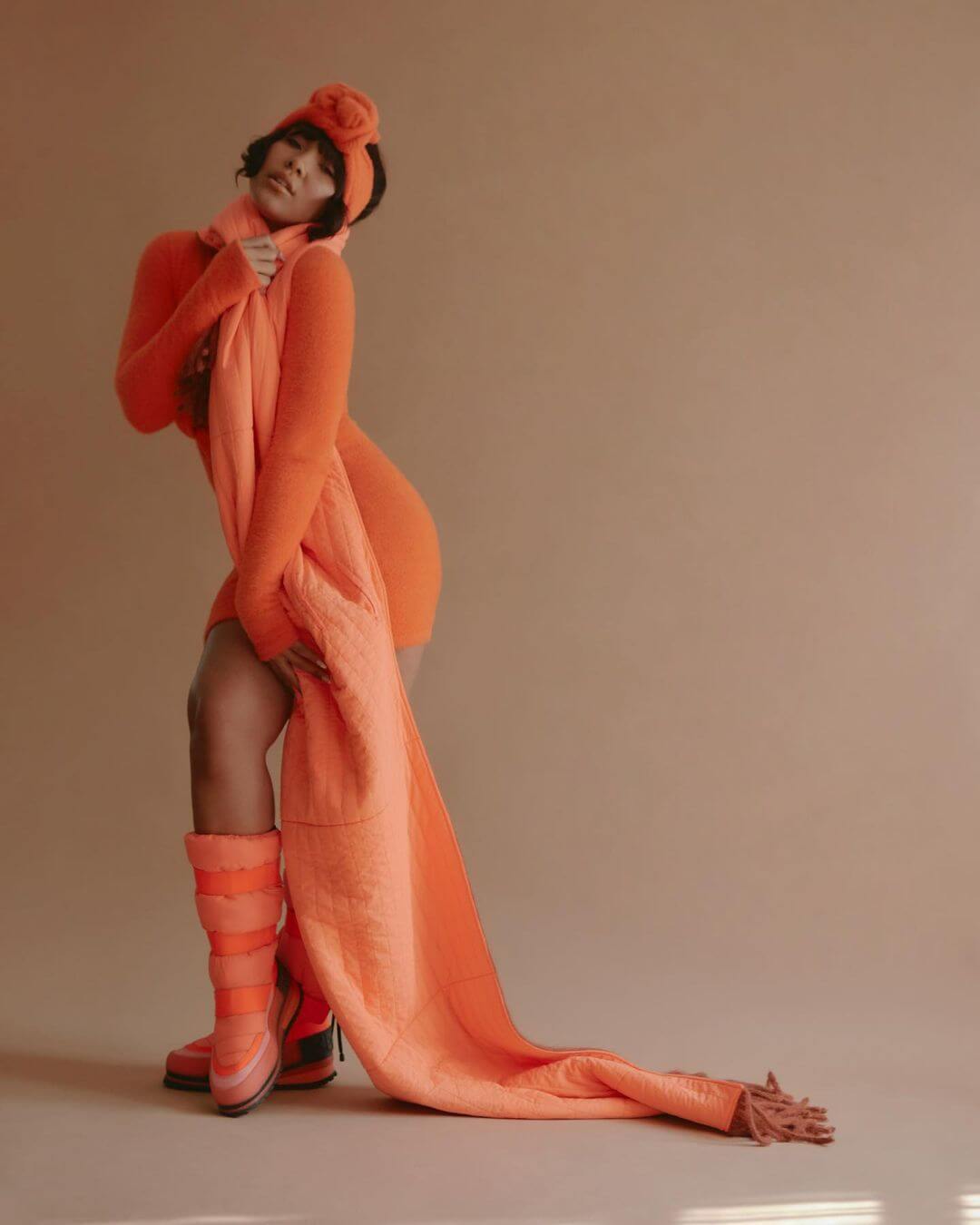 Parker McKenna Posey Shines in a Bright Orange Statement Look for Schon magazine Photoshoot