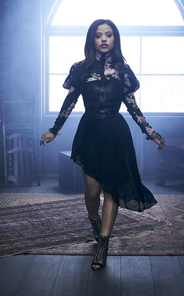 Sarah Jeffery In Black Halter Neck  Full Sleeves Ruffle Dress