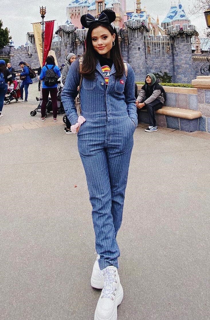 Sarah Jeffery In Blue Jumpsuit With White Shoes