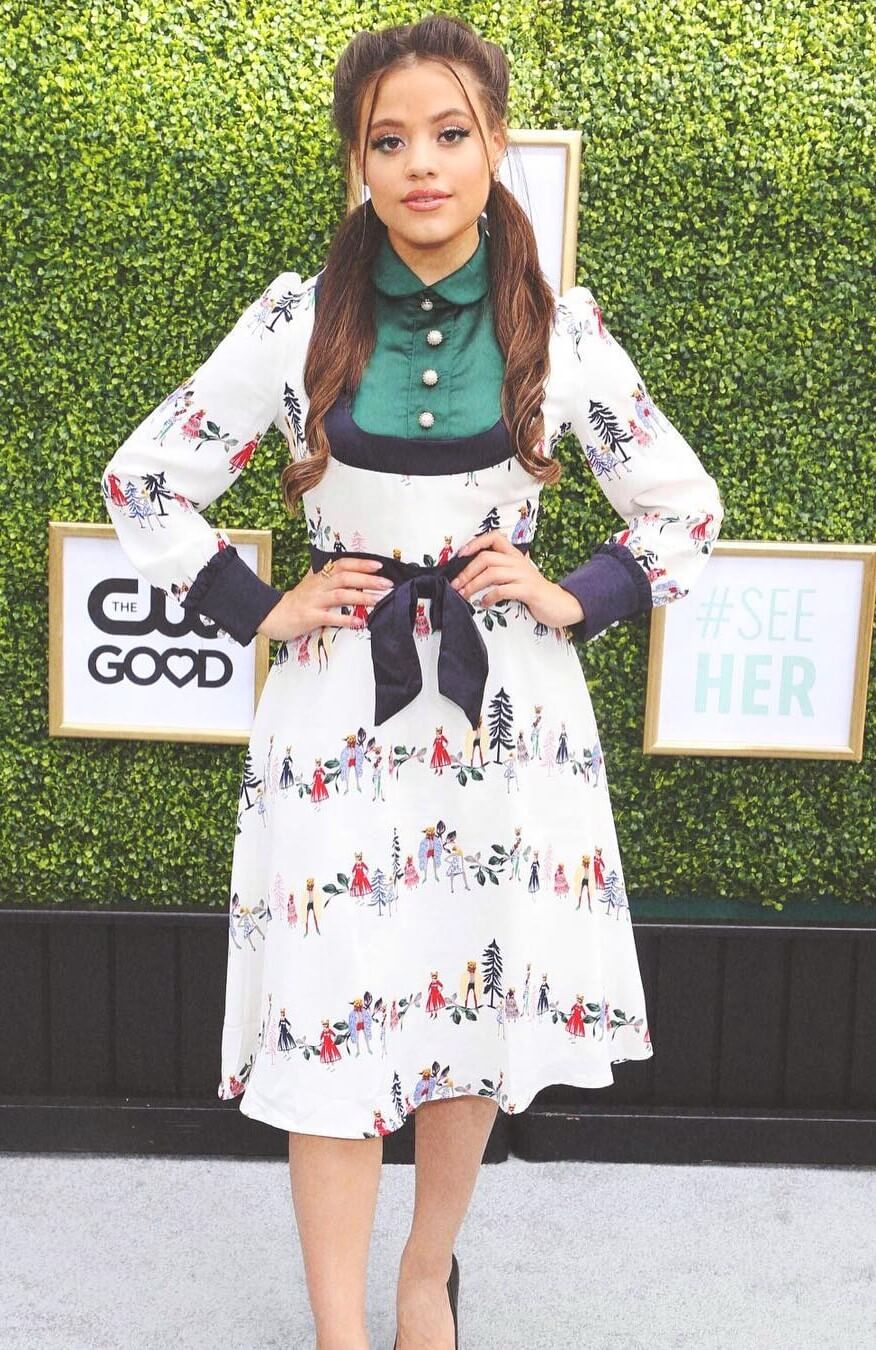Sarah Jeffery In White Floral Print Black Border With Green Collar Shirt Short Frock Outfit