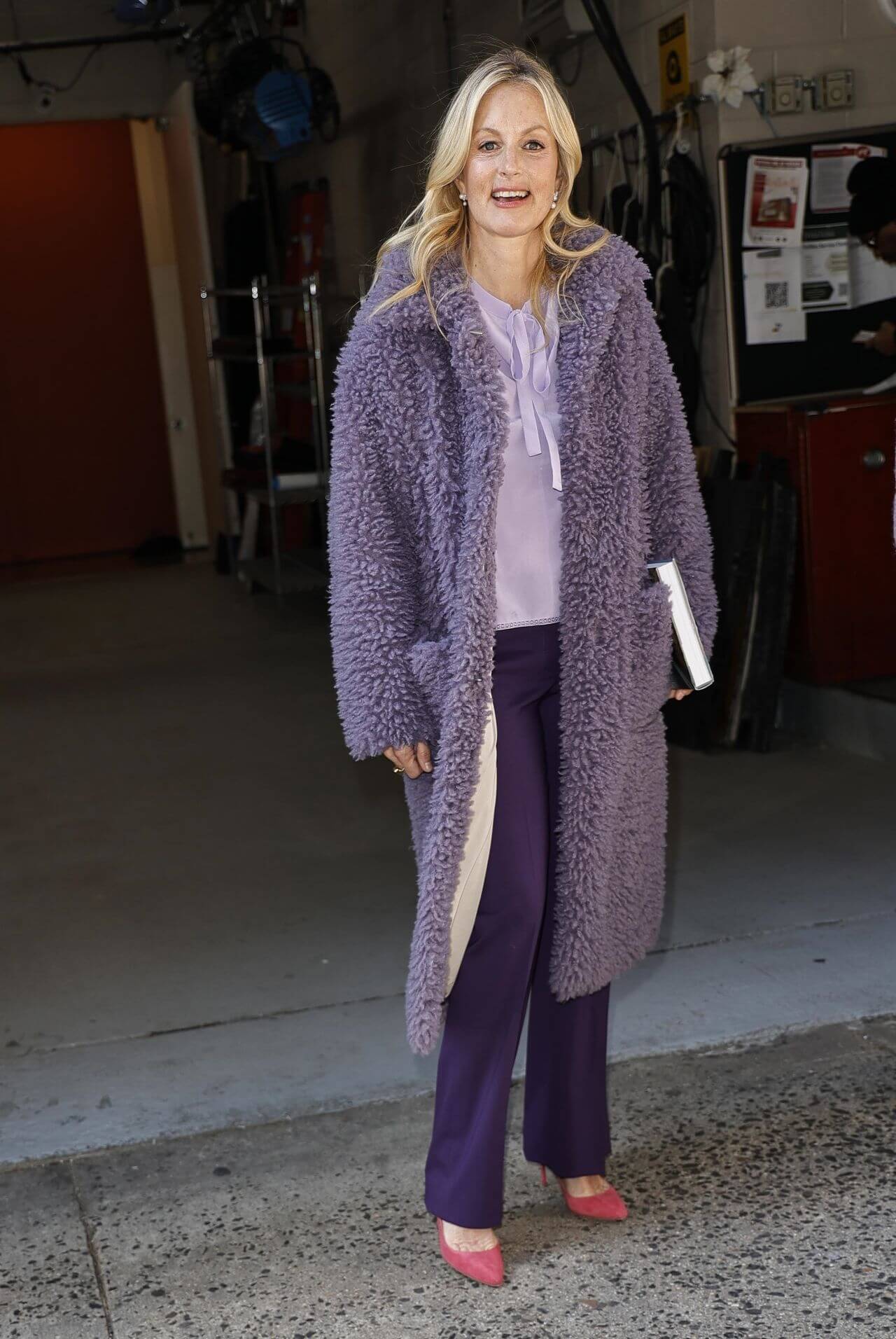Ali Wentworth – In Lavender Faux Fur Long Coat  With Purple Pants-  Exits Kelly and Ryan Show in New York
