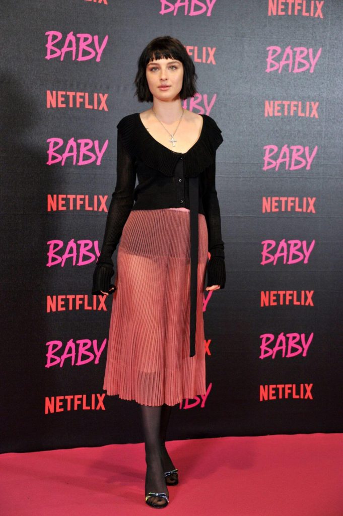Alice Pagani In Black Full Sleeve Top & Pink Skirt At “Baby” TV Series Photocall in Rome