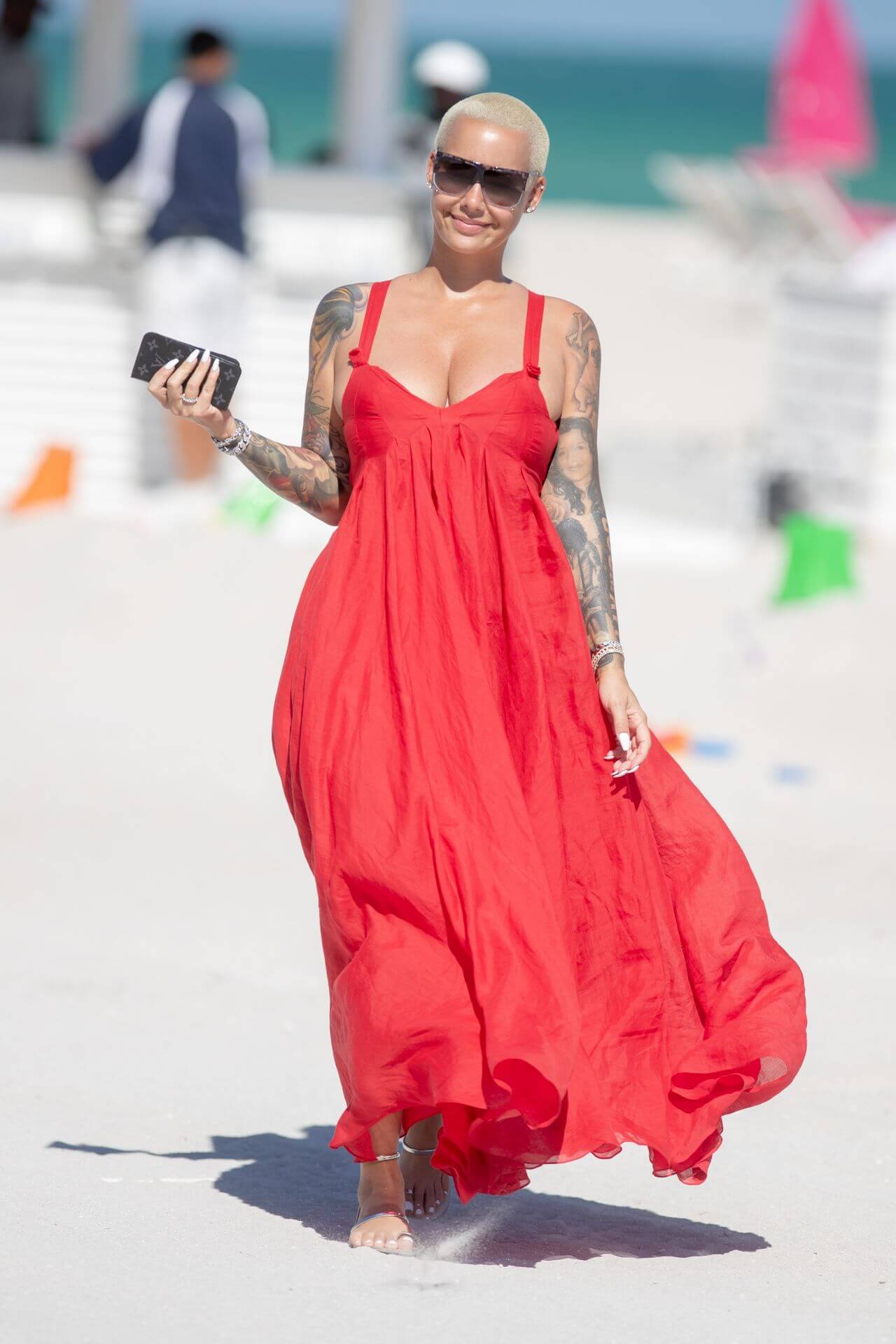 Amber Rose In Red Deep Neckline Long Flare Gown on the Beach in Miami