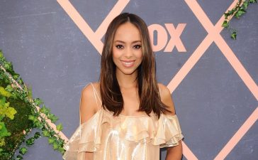 Amber Stevens West In Golden Shiny Off-Shoulder Ruffle Short Dress At Fox Fall 2017 Premiere Party in Los Angeles