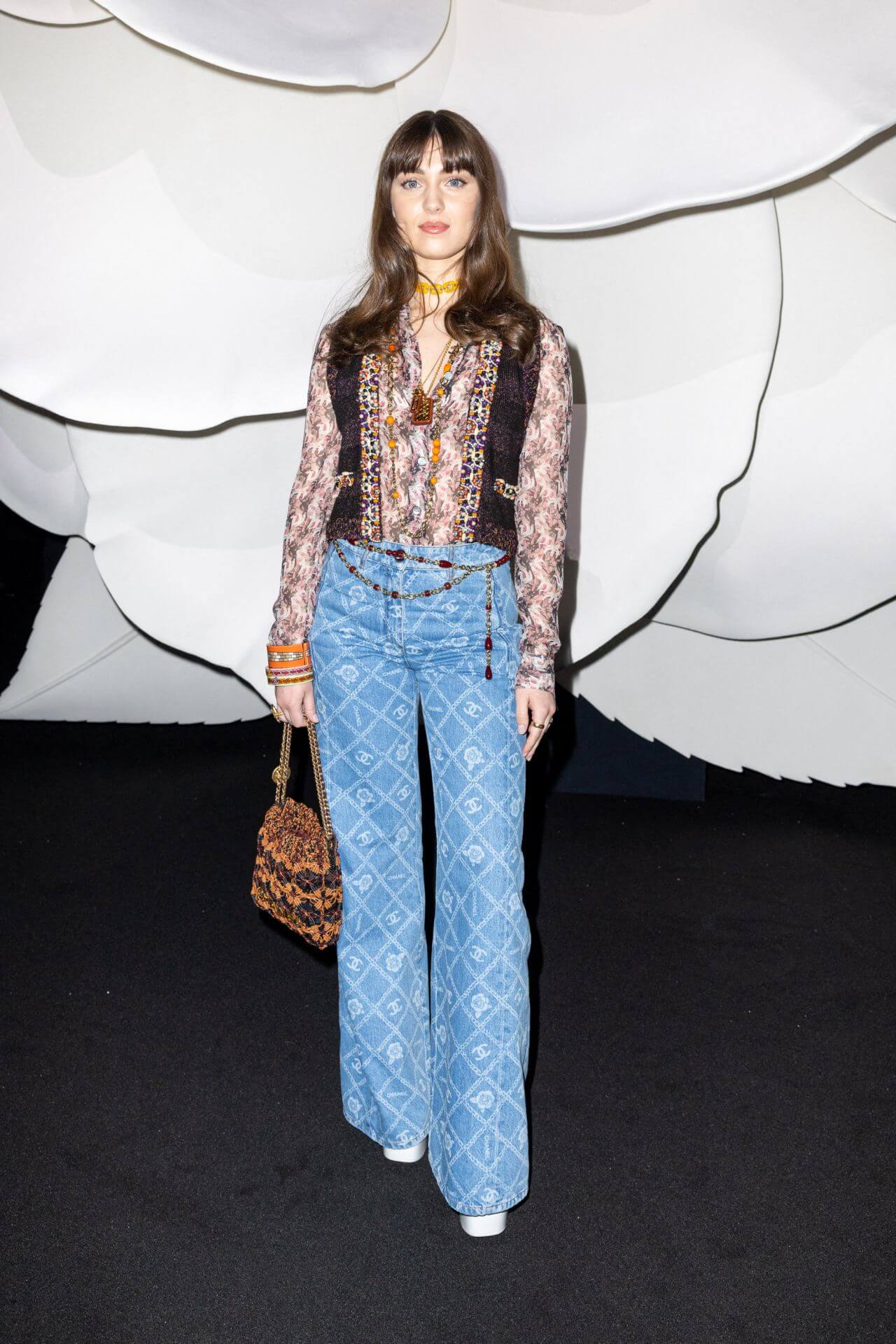 Anamaria Bartolomei  In  Printed Top With Blue Flare Jeans At Chanel Show In Paris Fashion Week