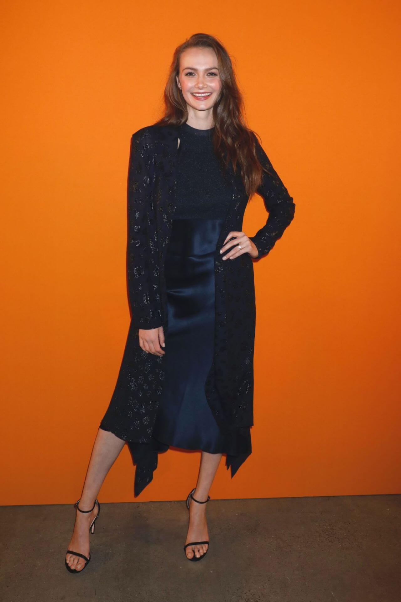 Andi Matichak In Blue Shiny Satin Fabric Long Dress With Black Printed Long Shrug Ar Cushnie Fashion Show at New York Fashion Week