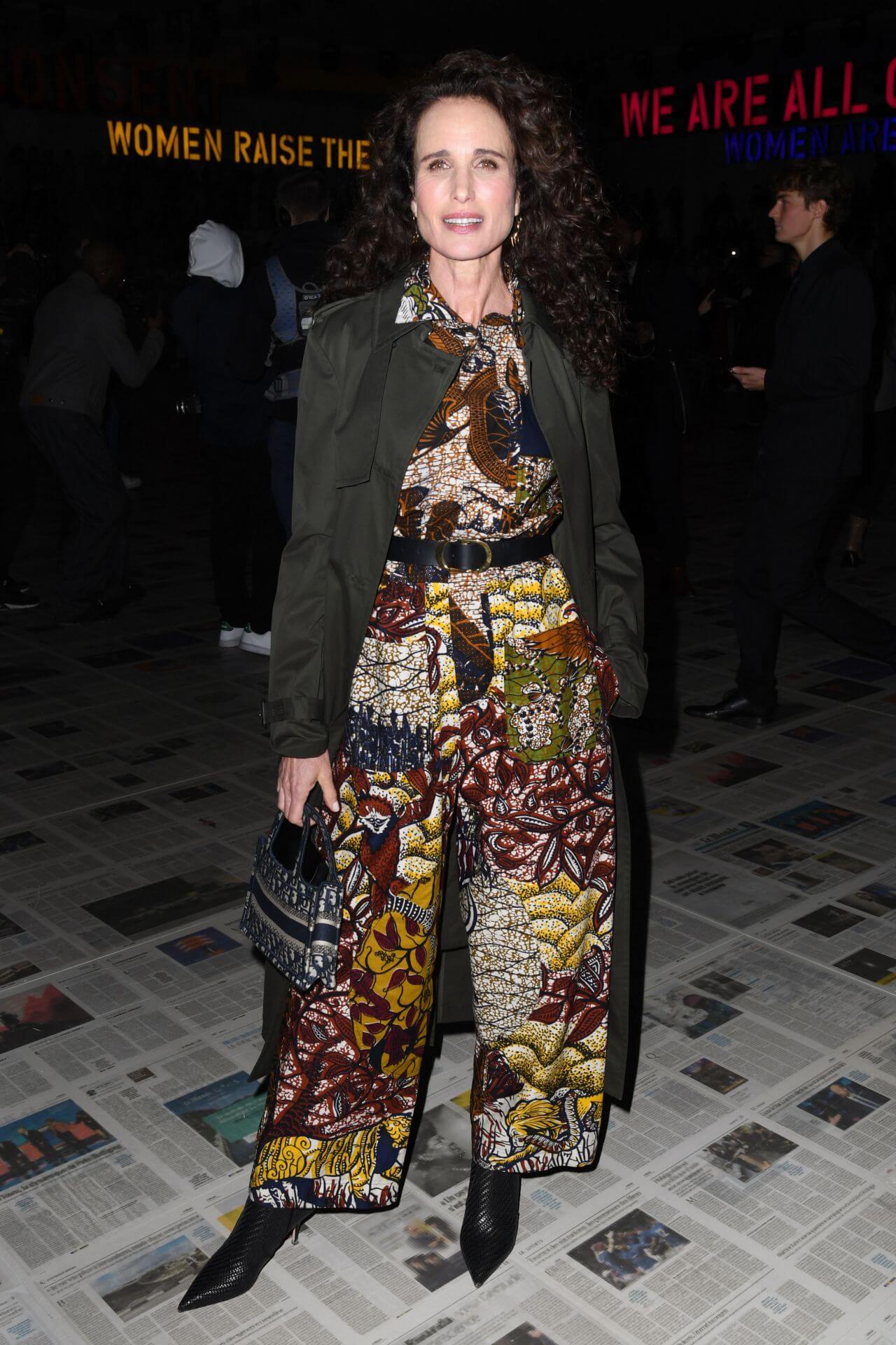 Andie MacDowell In Printed Long Dress With Olive Green Long Coat At Dior Show In Paris Fashion Week
