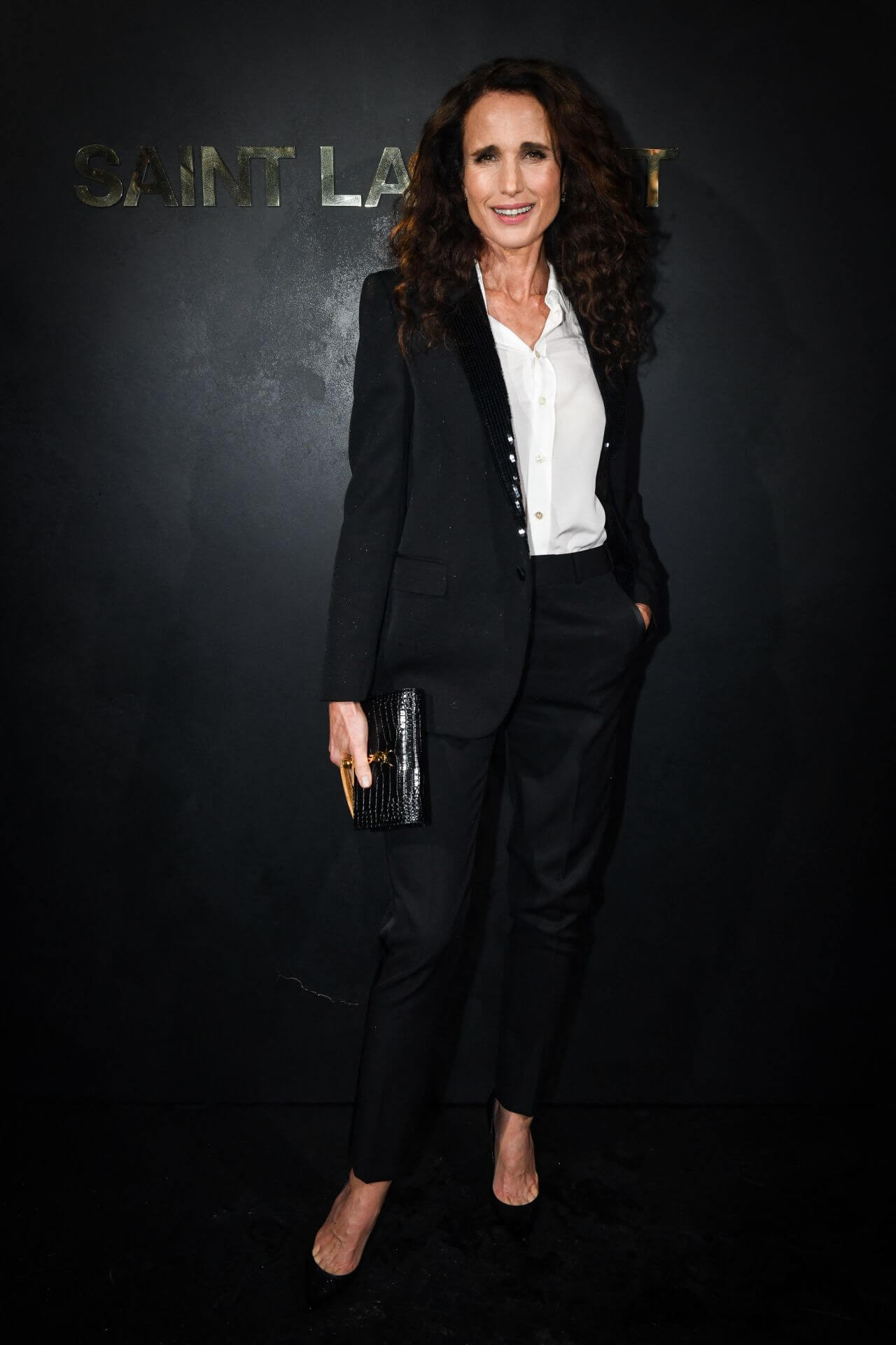 Andie MacDowell In White Shirt With Blazer & Pants Outfits At Saint Laurent Show at Paris Fashion Week