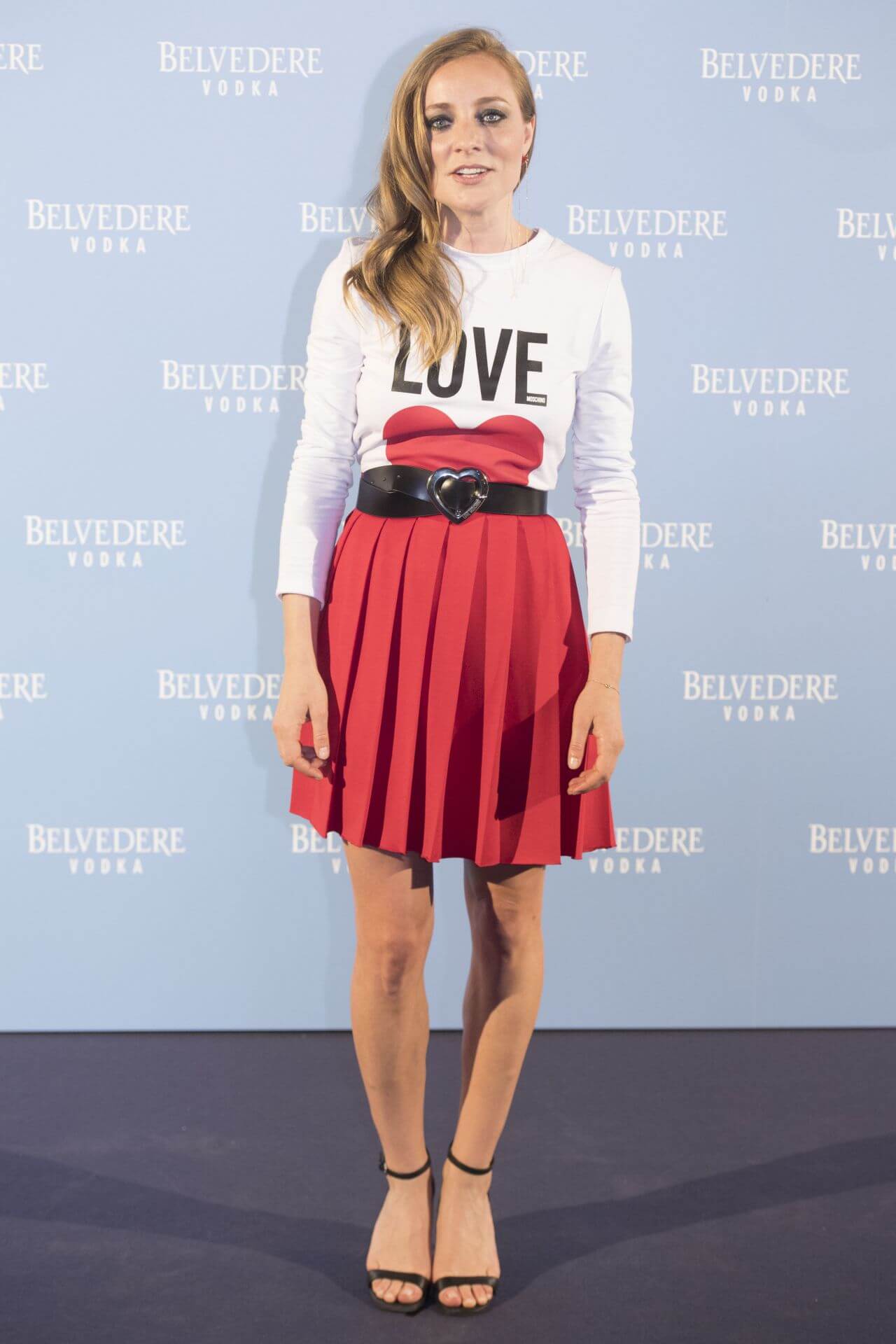 Angela Cremonte In White Full Sleeves T-Shirt With Red Pleated Mini Skirt Outfits Belvedere Vodka Party in Madrid, Spain