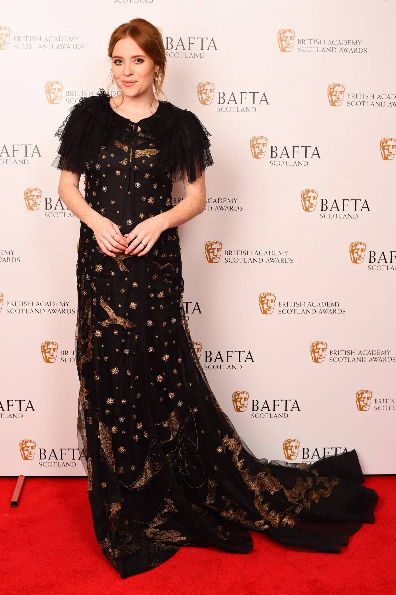 Angela Scanlon In Black Net Ruffle Sleeves With Golden Shiny Patches Long Flare Gown At British Academy Scotland Awards  in Glasgow