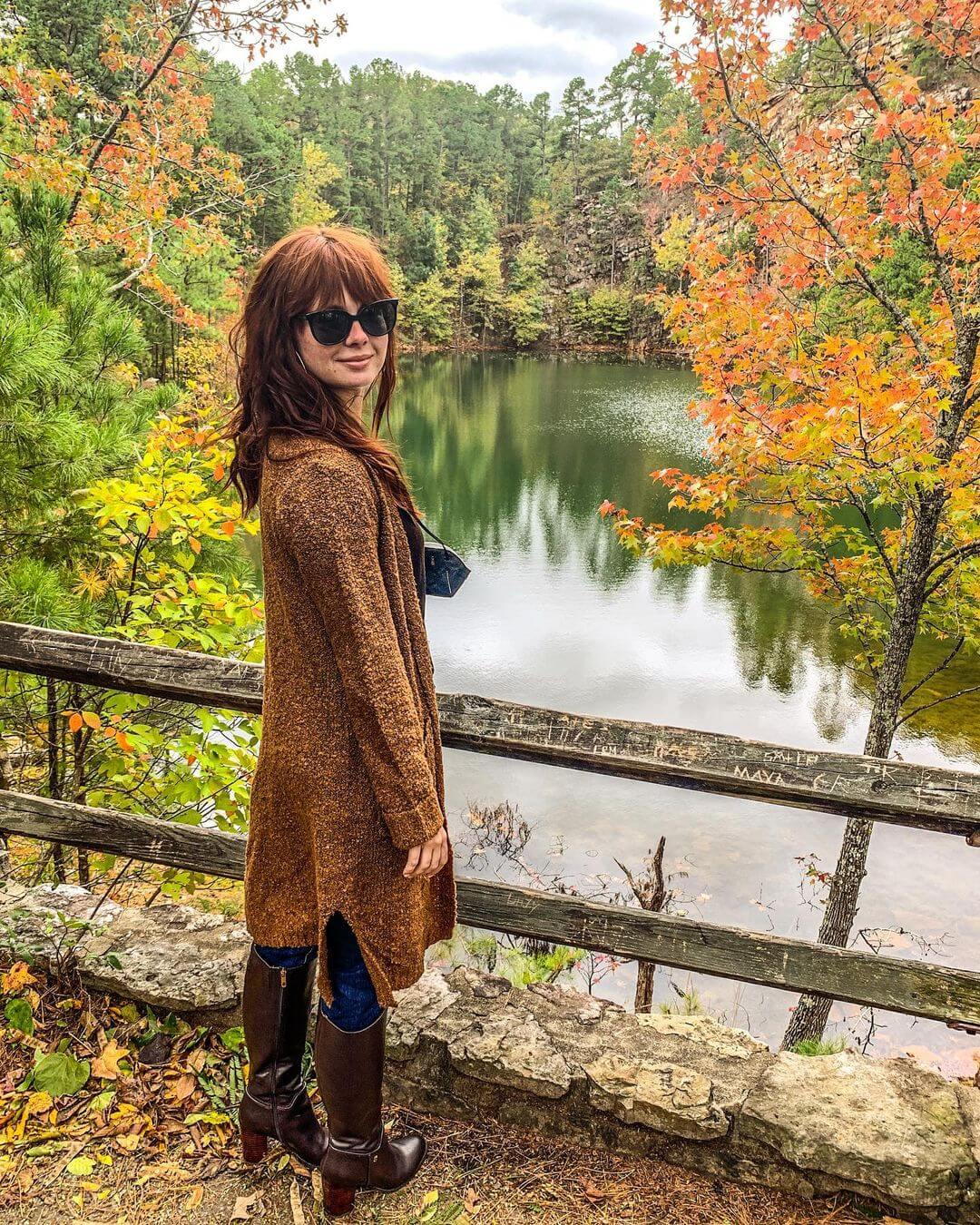 Galadriel Stineman  In Goldish Brown Long Cardigan & Blue Denim Jeans With Long Boots