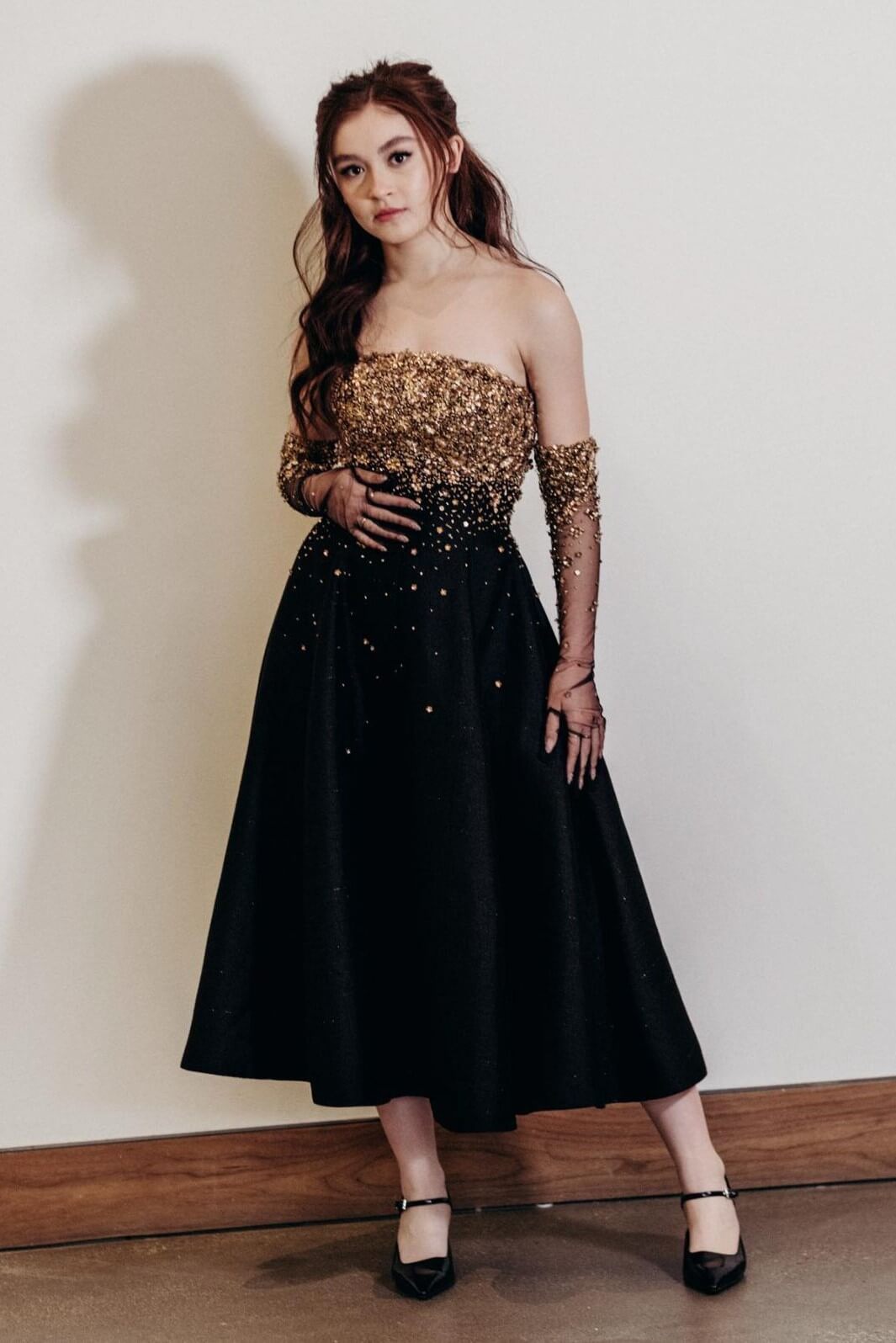 Anna Cathcart In Black With Golden Sparkling Embroidery Strapless Long Gown With Net Shimmery Hand Gloves