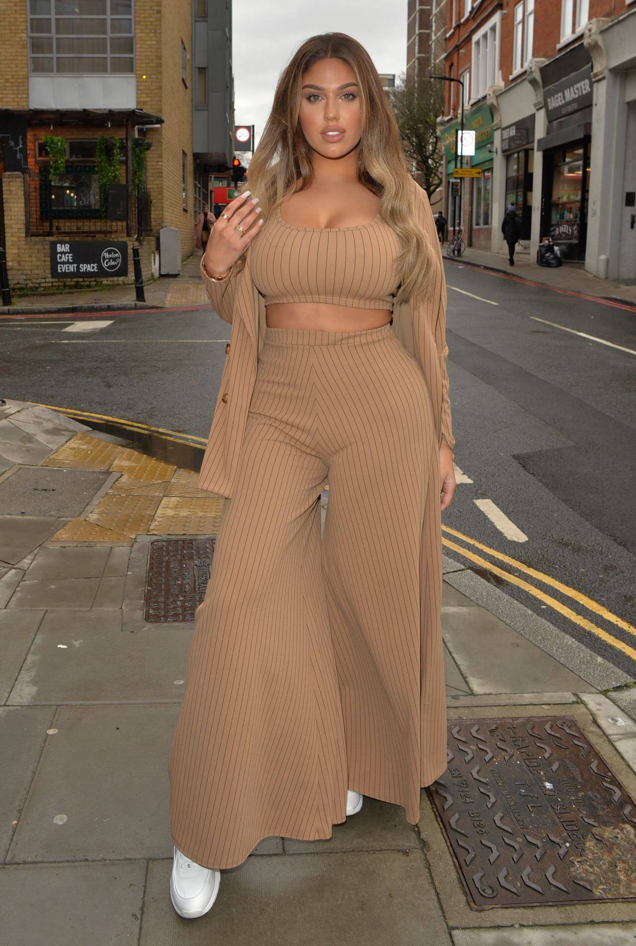Anna Vakili In Brown Crop Top & Flare Palazzo Pants With Long Shrug At HLD Studios in London