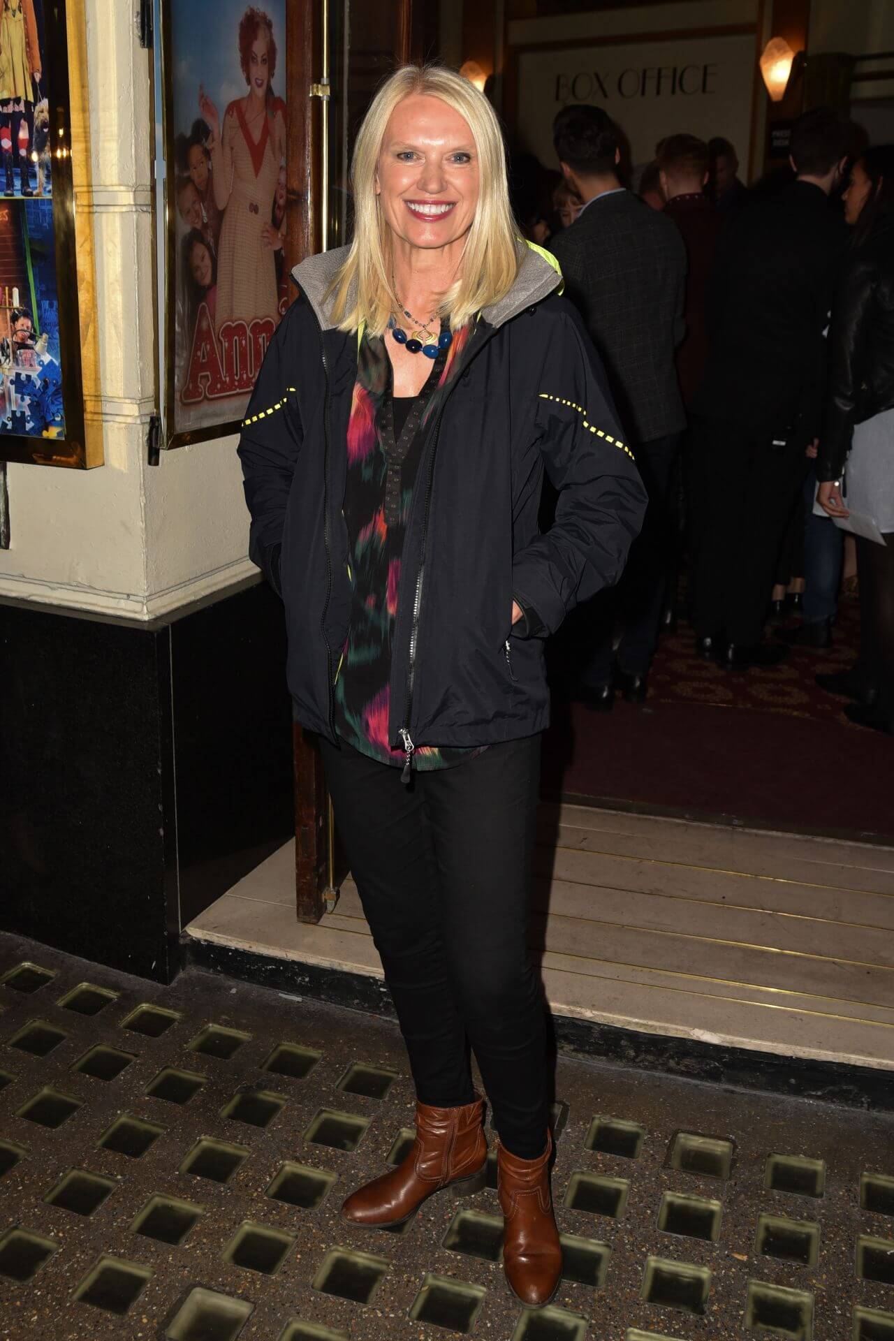 Anneka Rice In Black Printed Long T-Shirt With Bomber Jacket At“Annie” Press Night in London