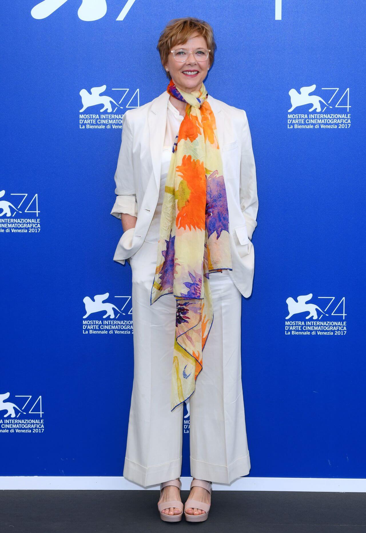 Annette Bening In White Blazer & Flare Pants With Colorful Scarf At Jury Photocall Venice International Film Festival