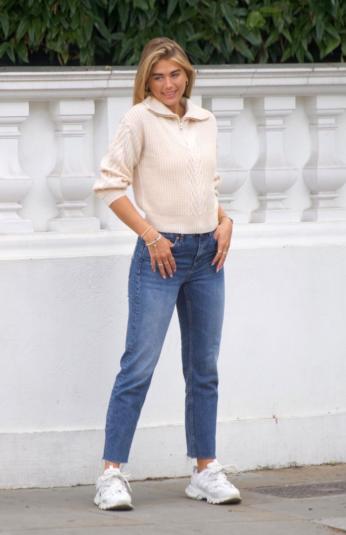 Arabella Chi In Off White Woolen With Collar Sweater& Blue Denim Jeans At Photoshoot in London