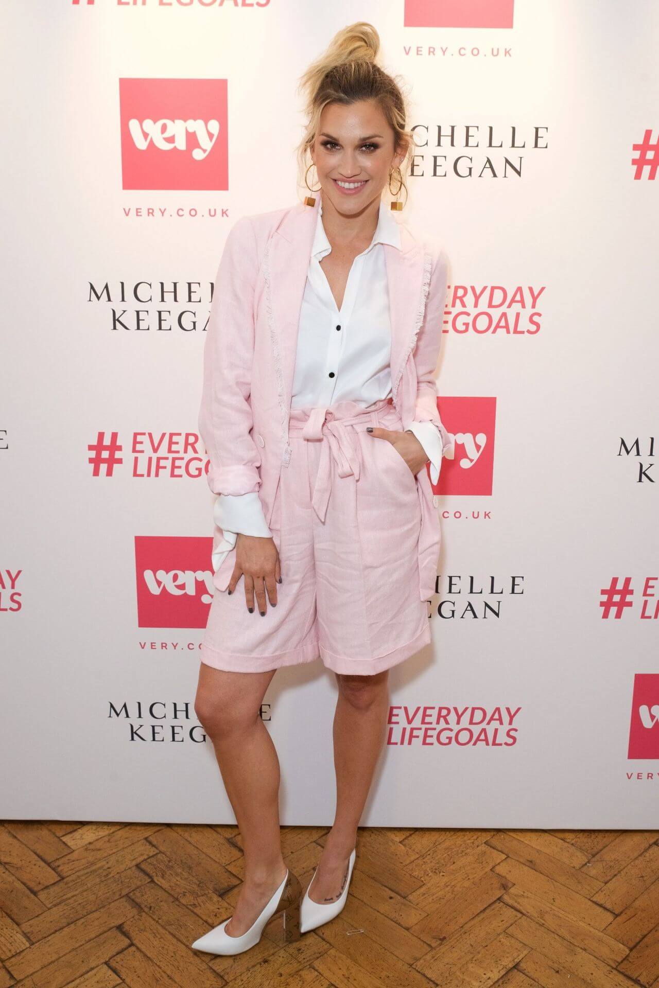 Ashley Roberts In White Shirt With Pink Long Jacket With Short Pants At Michelle Keegan Launches Her Very Clothing Range in London