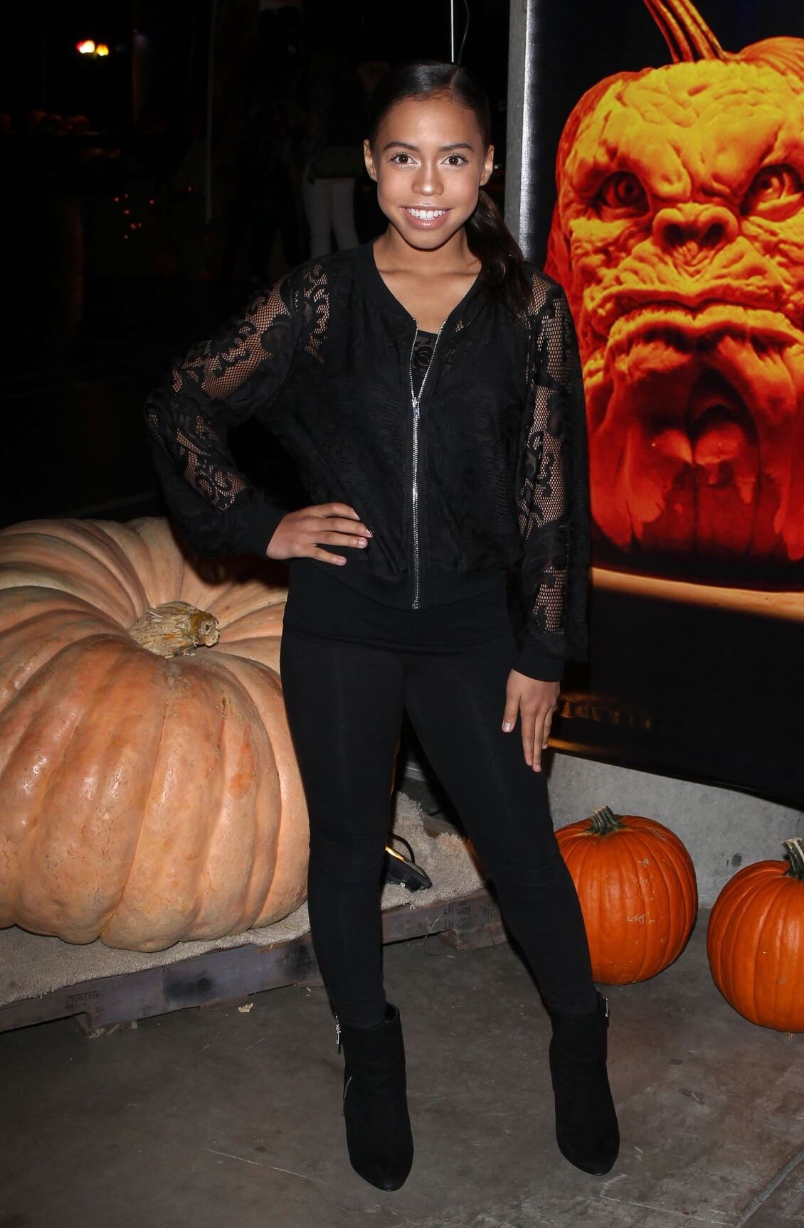 Asia Monet Ray In Black Net Full Sleeves ZippedTop With Jeans At Rise of the Jack O’Lanterns in Los Angeles