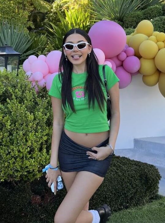 Atiana de la Hoya In Green T- Shirt With Mini Skirt Outfit
