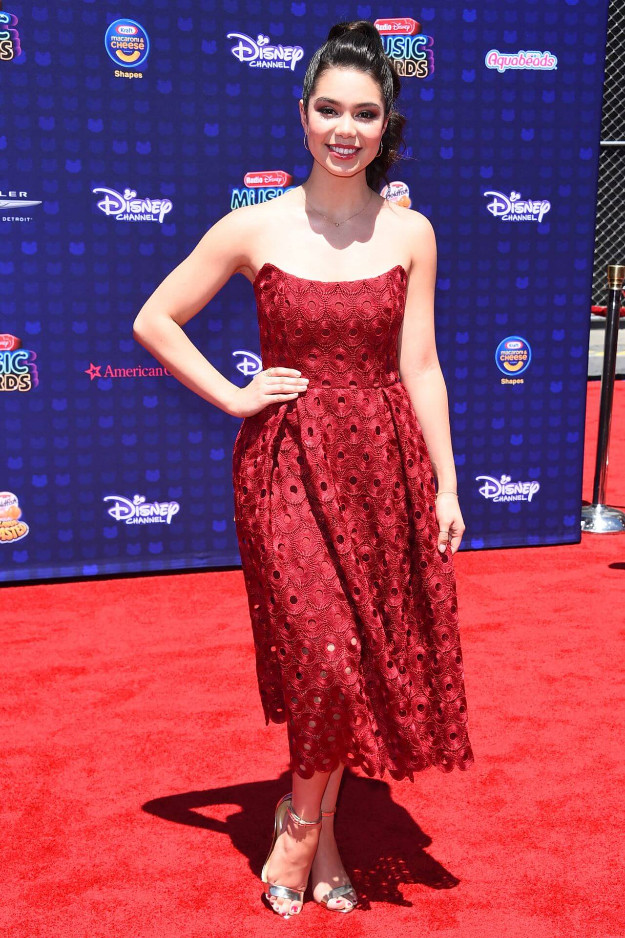 Auli’i Cravalho  In Maroon Strapless Long Gown Dress At Radio Disney Music Awards in Los Angeles