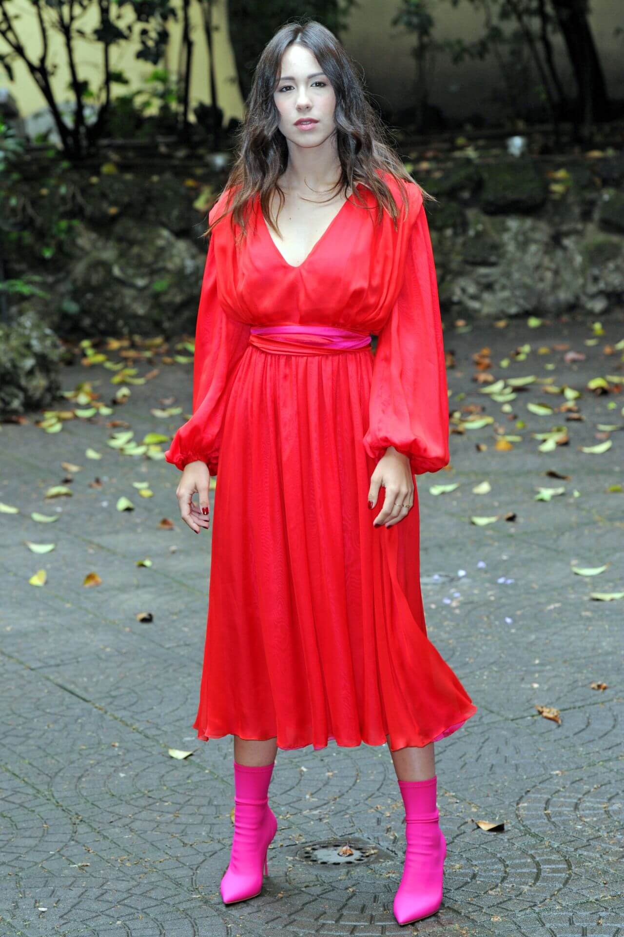 Aurora Ramazzotti  In Red Baggy Sleeves Long Pleated Gown With Pink Boots