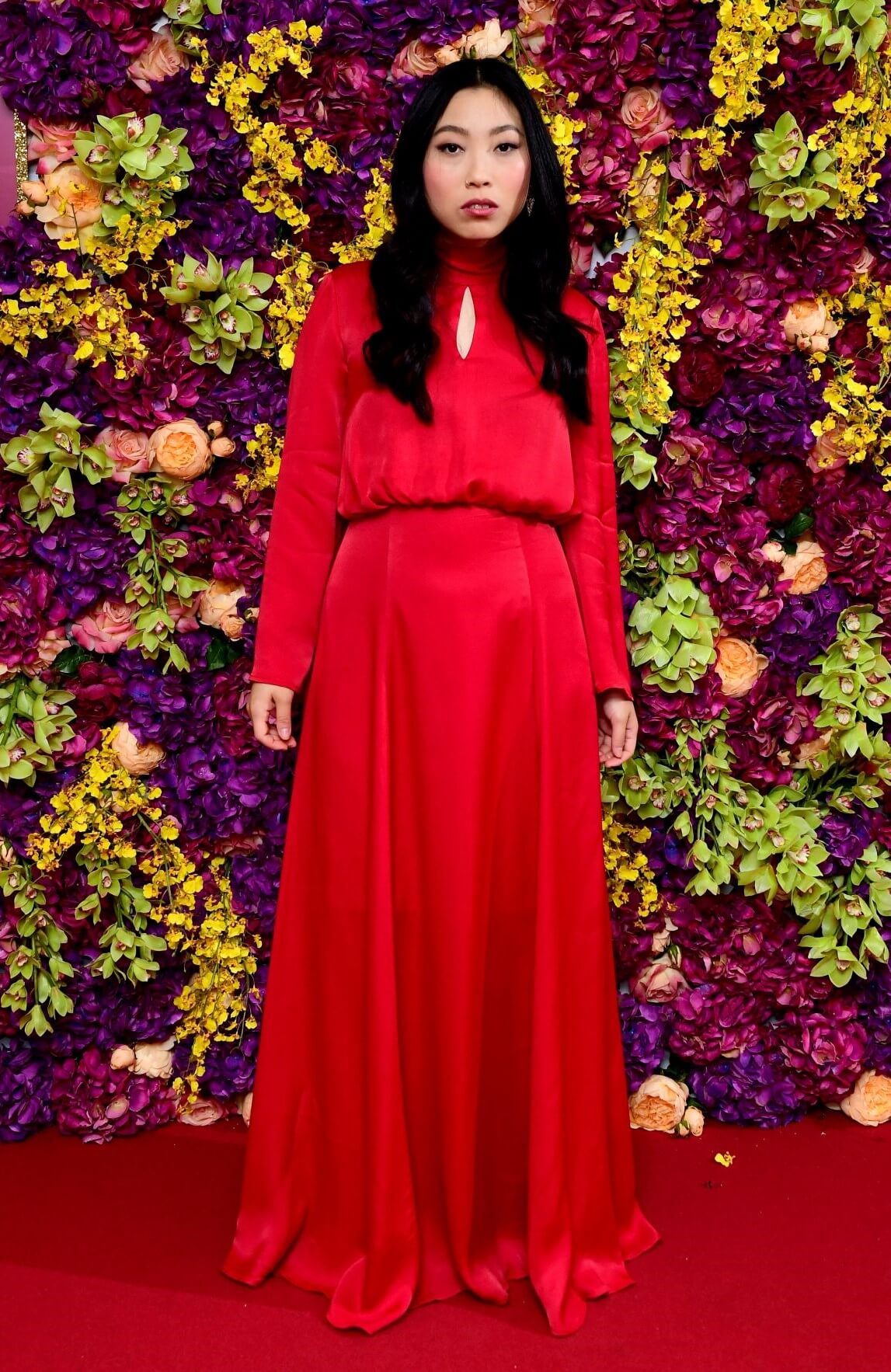 Awkwafina In Red Full Sleeves Long Gown At “Crazy Rich Asians” Premiere in London