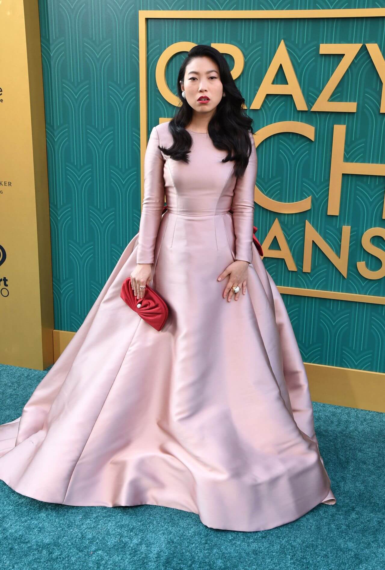 Awkwafina  In Shiny Dusky Pink Full Sleeves Long Flare Gown At “Crazy Rich Asians” Premiere in LA