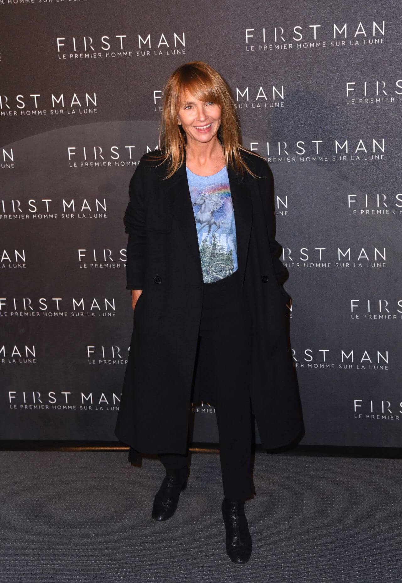 Axelle Laffont  In a Black Long Blazer Coat Under a Blue T-shirt With Pants At “First Man” Premiere in Paris