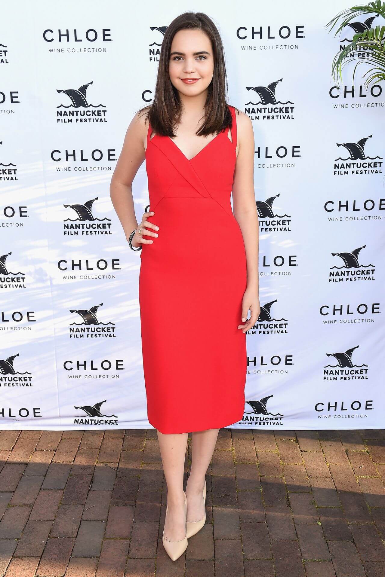 Bailee Madison In Red Sleeveless Long Dress At Nantucket Film Festival  Screenwriters Tribute