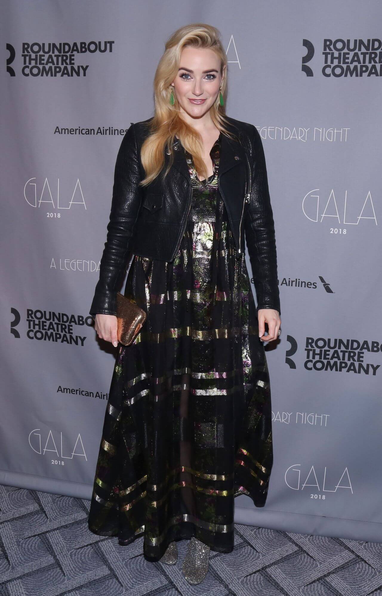 Betsy Wolfe In Black Printed shimmery Long Gown With Leather Jacket At Roundabout Theatre Company Gala in New York