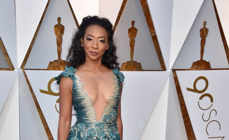 Betty Gabriel In Sea Green Deep Neckline Sleeveless Shimmery Work Long Flare Gown At Oscars Red Carpet
