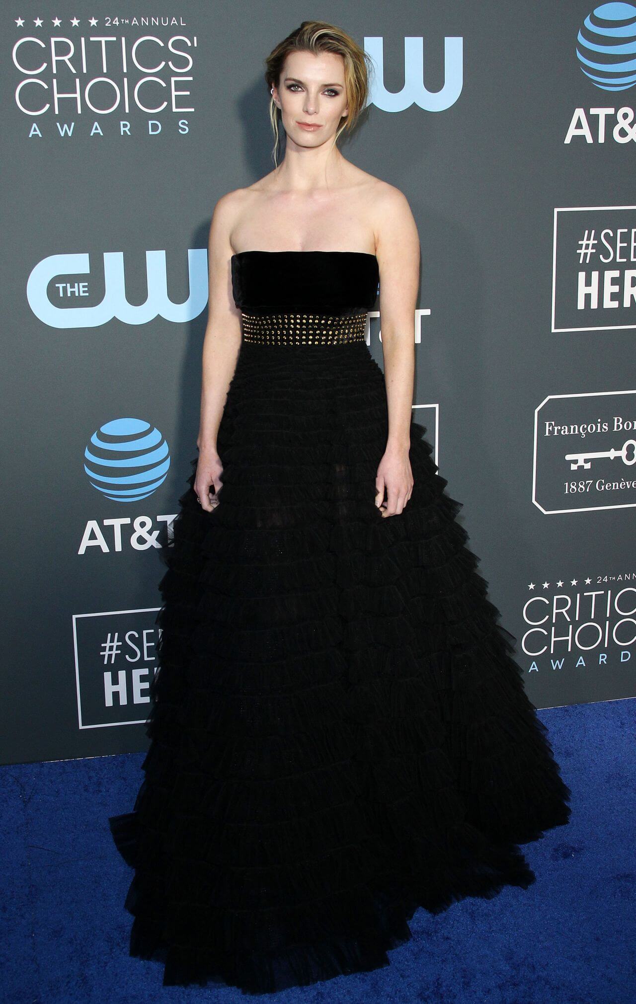 Betty Gilpin Gorgeous In Black Strapless Long Fairytale Gown With Golden Waist Belt At Critics’ Choice Awards