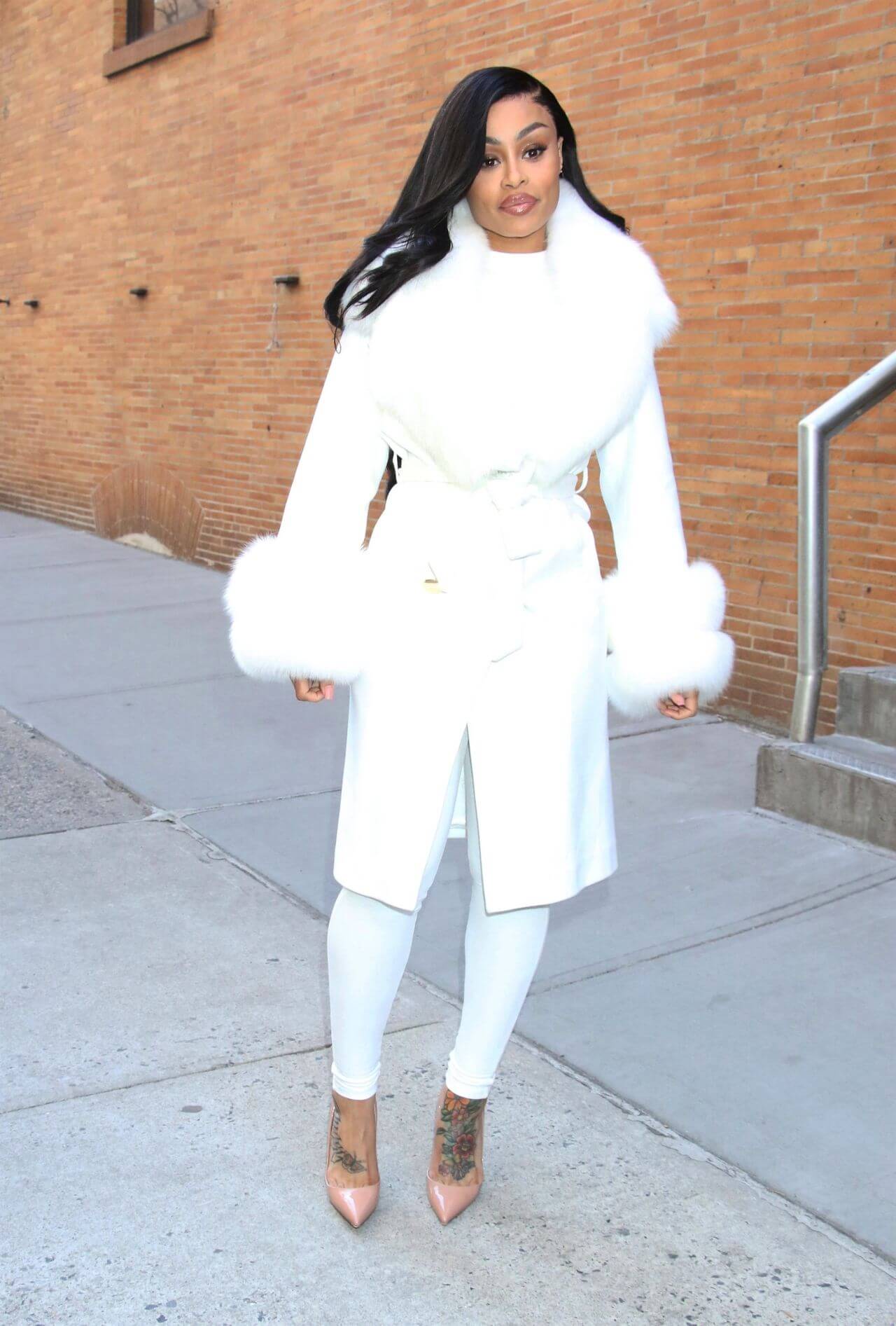 Blac Chyna  In White Long Fur Coat Under Jeggings At Tamron Hall in New York
