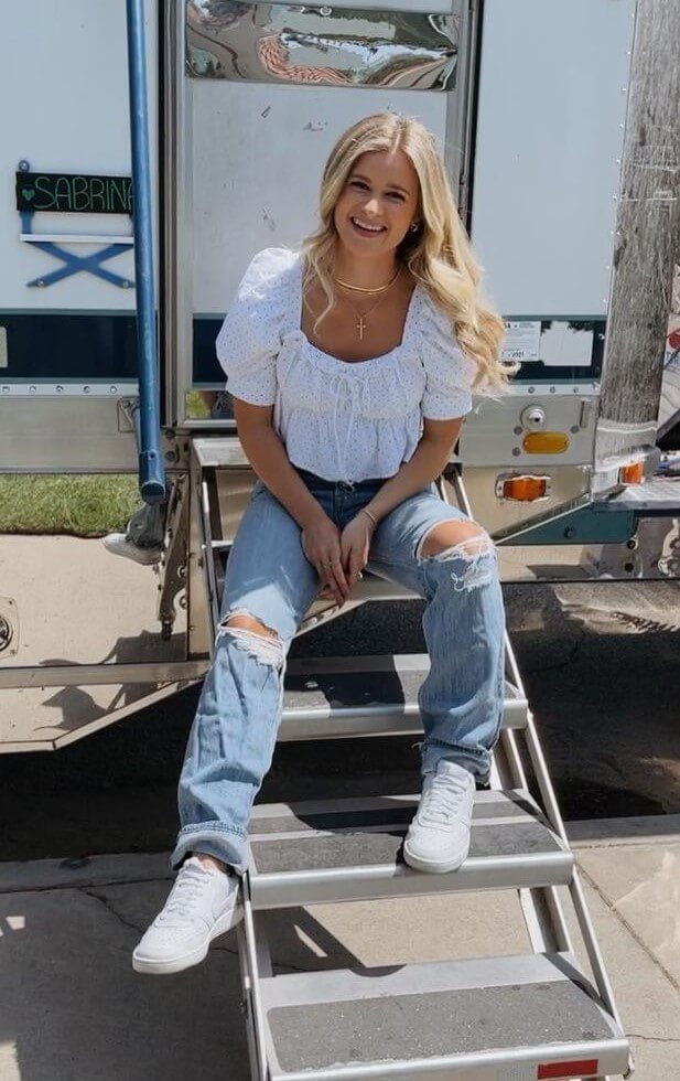 Jenna Boyd Redefined Elegance In A White Top And Denim Jeans