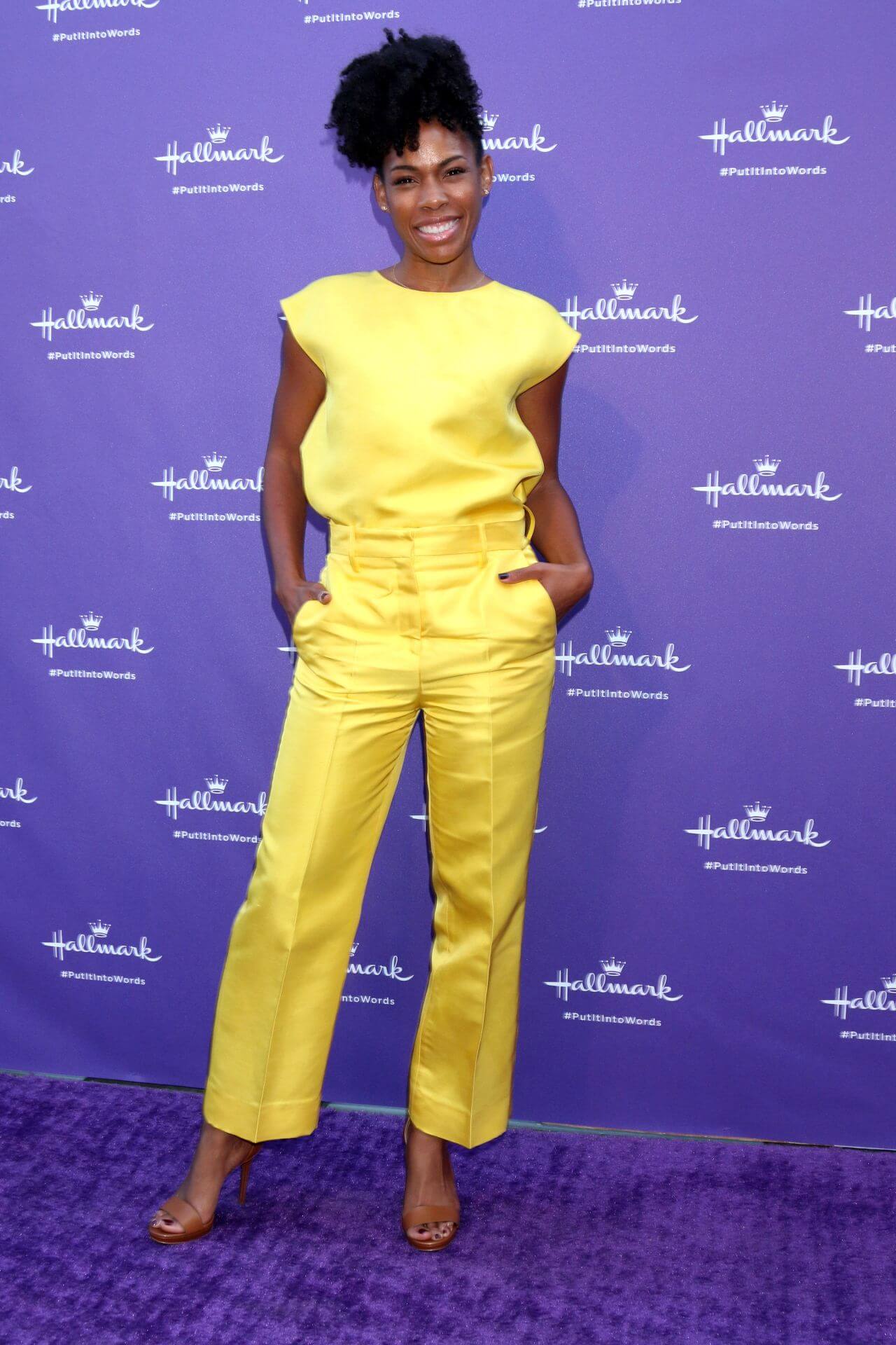 Angela Lewis In Yellow Jumpsuit Outfits At Hallmark’s Put It Into Words Campaign Launch Party in LA