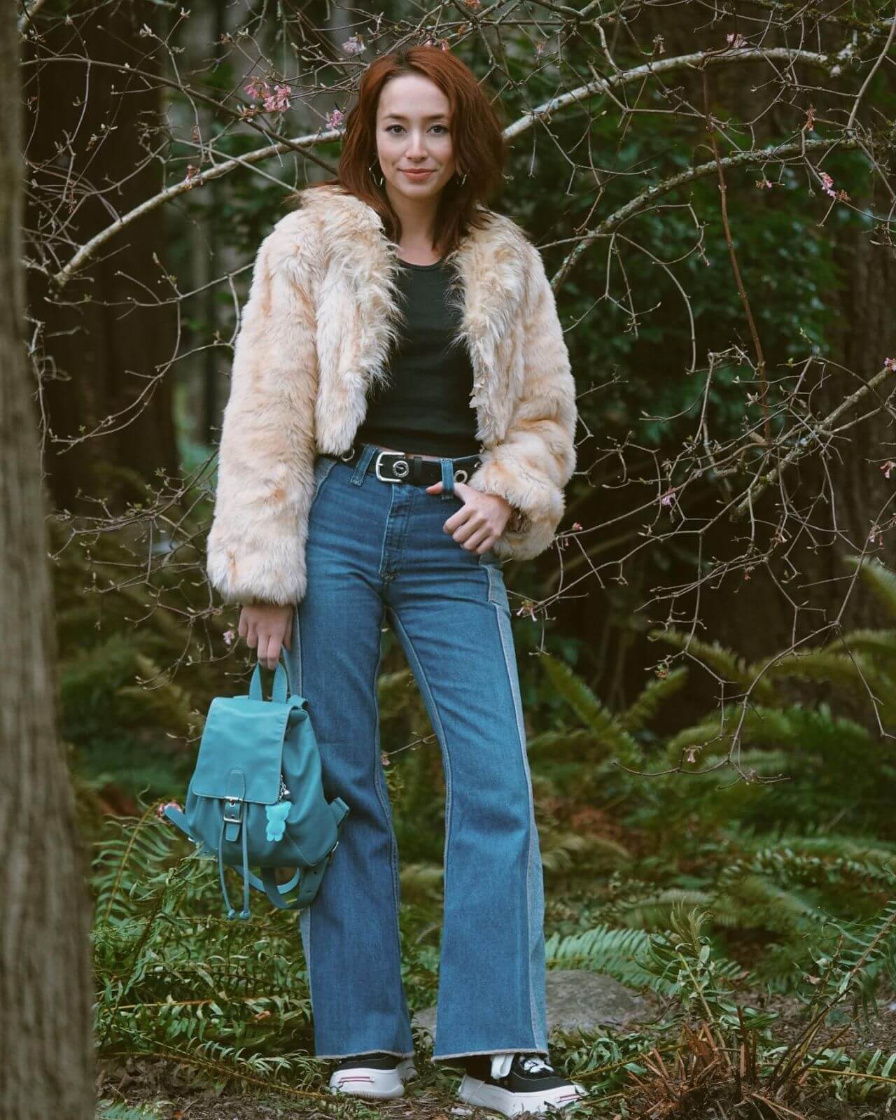 Ann Makosinski  In Green Top & Blue Denim Jeans With Off White Fur Jacket