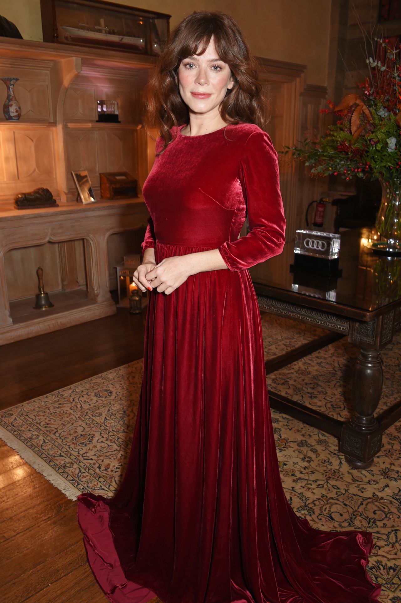 Anna Friel  In Red Velvet Full Sleeves Pleated Long Flare Gown At Audi A8 Launch in Midhurst