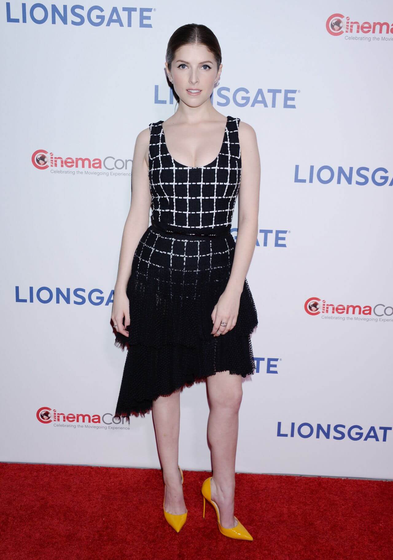 Anna Kendrick  In Black Checked Sleeveless Ruffle Short Dress At Lionsgate Presentation in Las Vegas