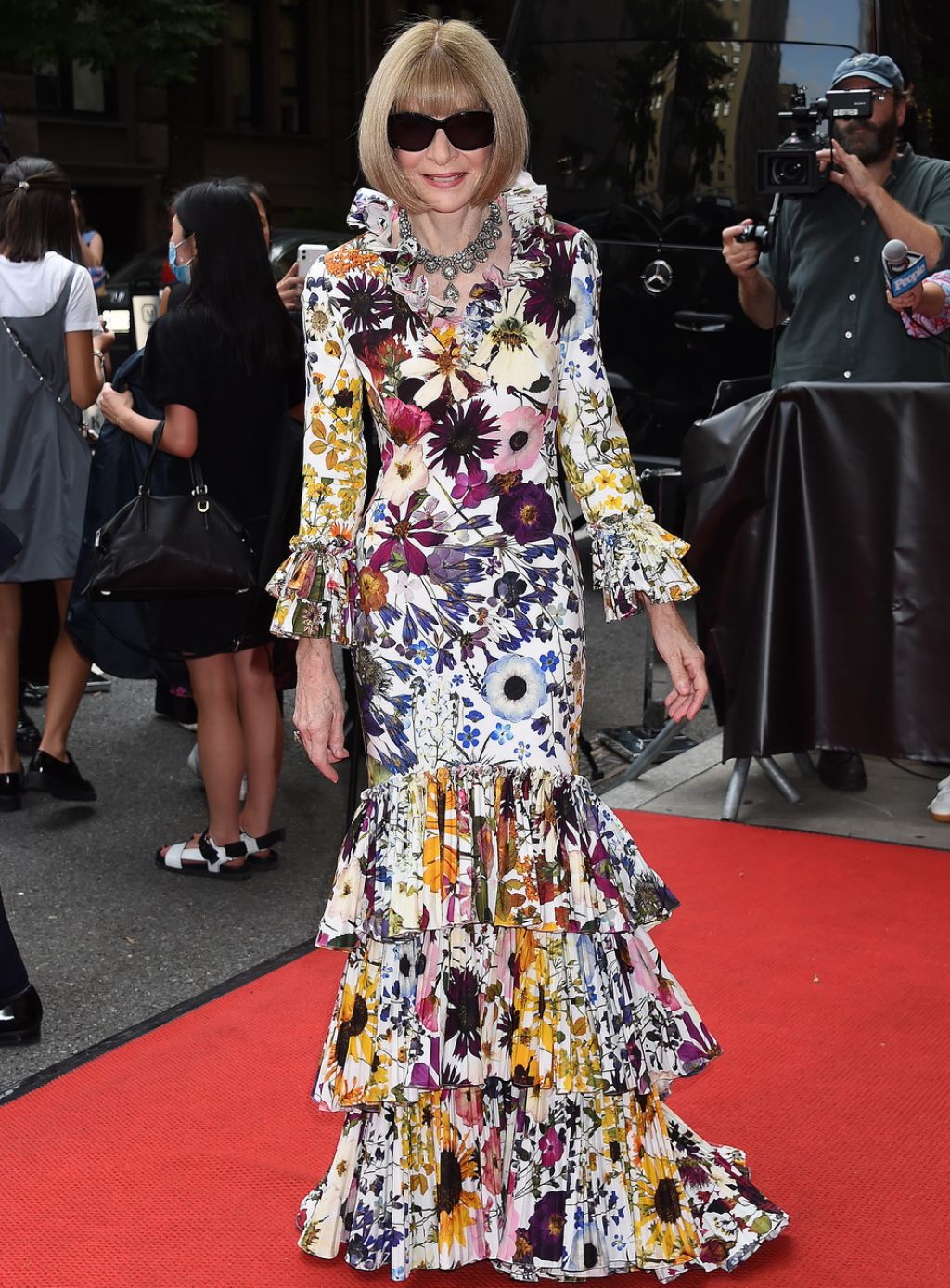 Anna Wintour In Multi-Floral Printed Ruffle Sleeves Layered Ruffle Gown