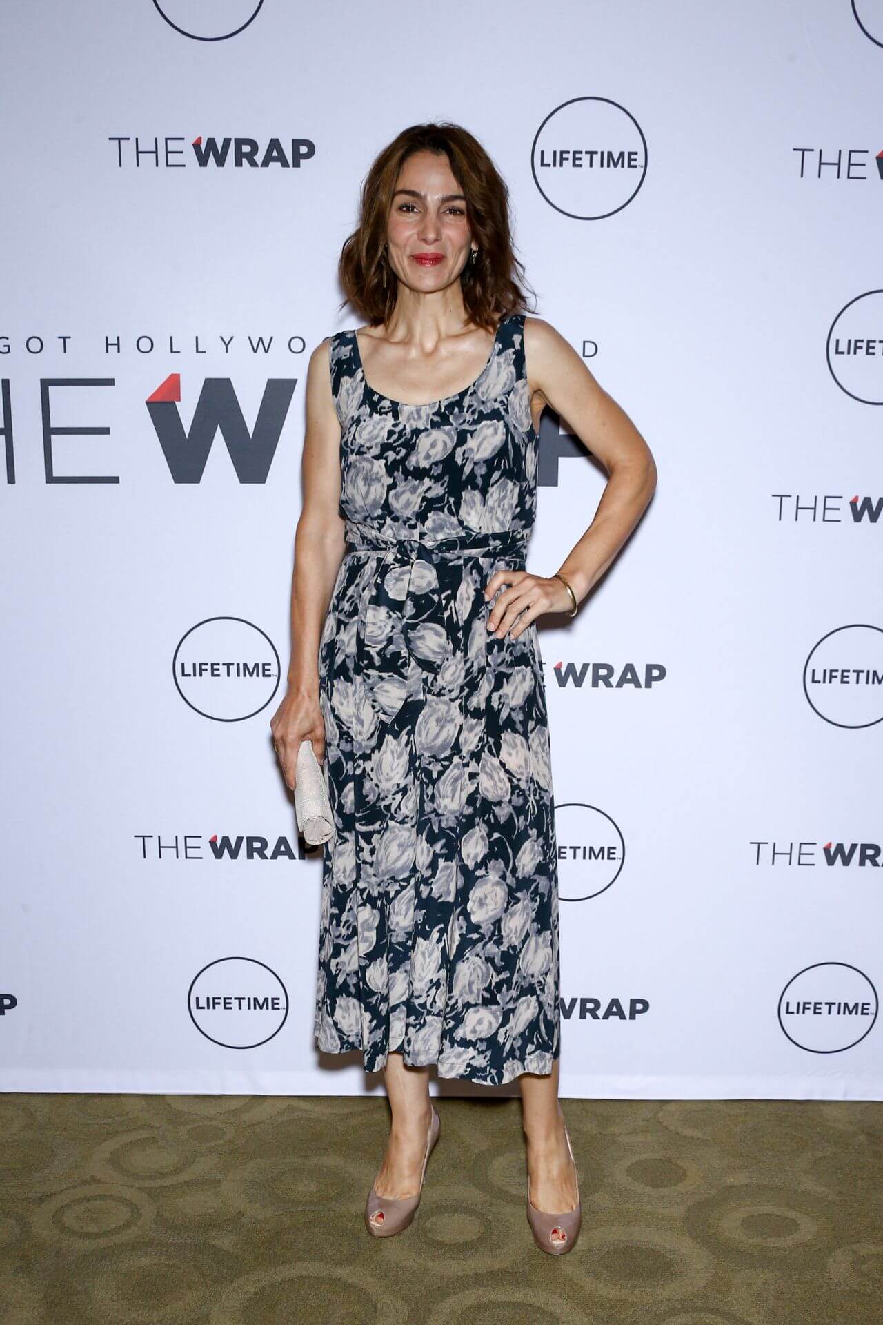 Annie Parisse  In a Black Floral Printed Sleeveless Long Dress At Power Women Breakfast in New York