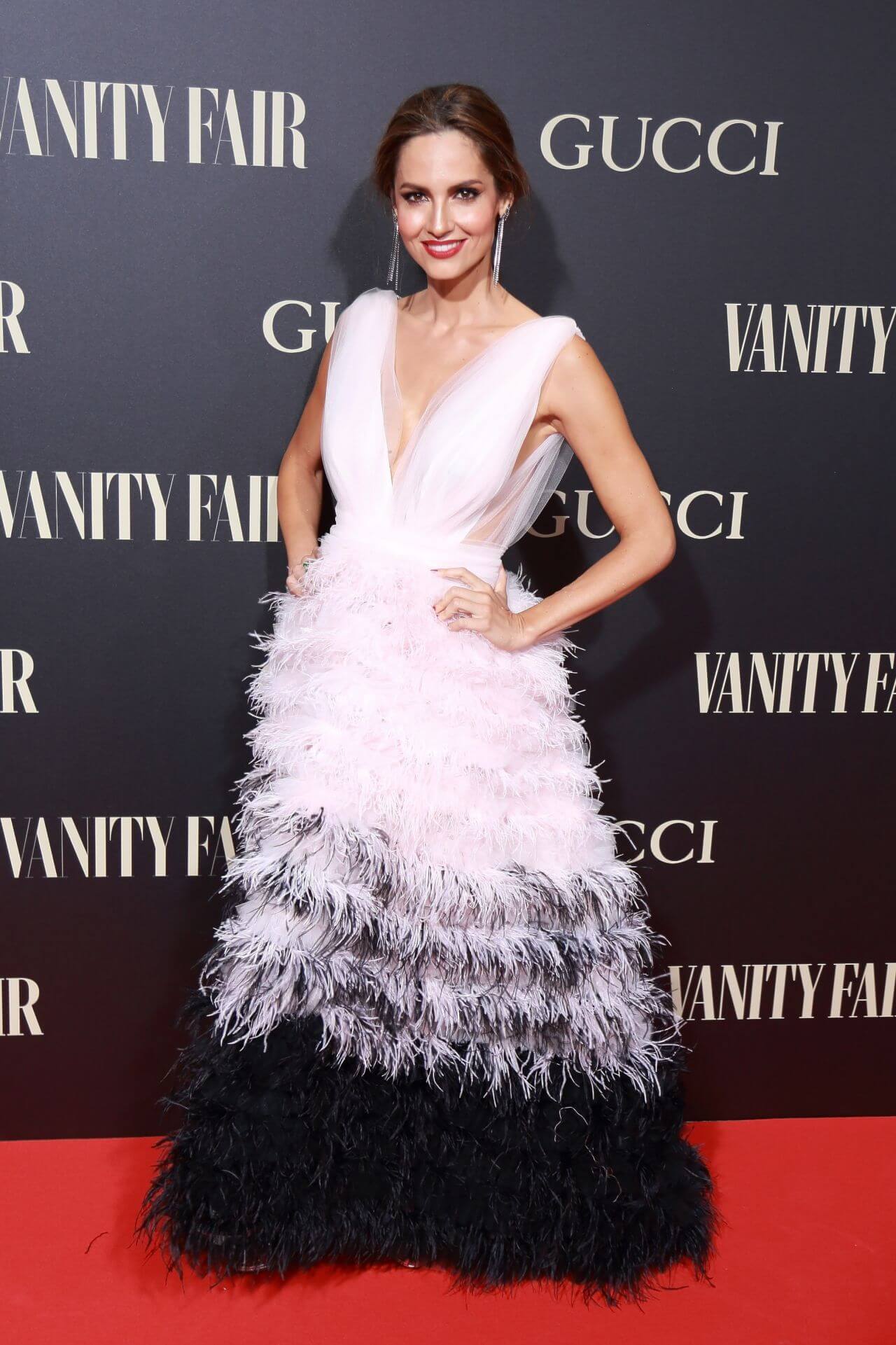 Ariadne Artiles In White Net Fabric With Shaded Black Feather Sleeveless Long Gown Dress