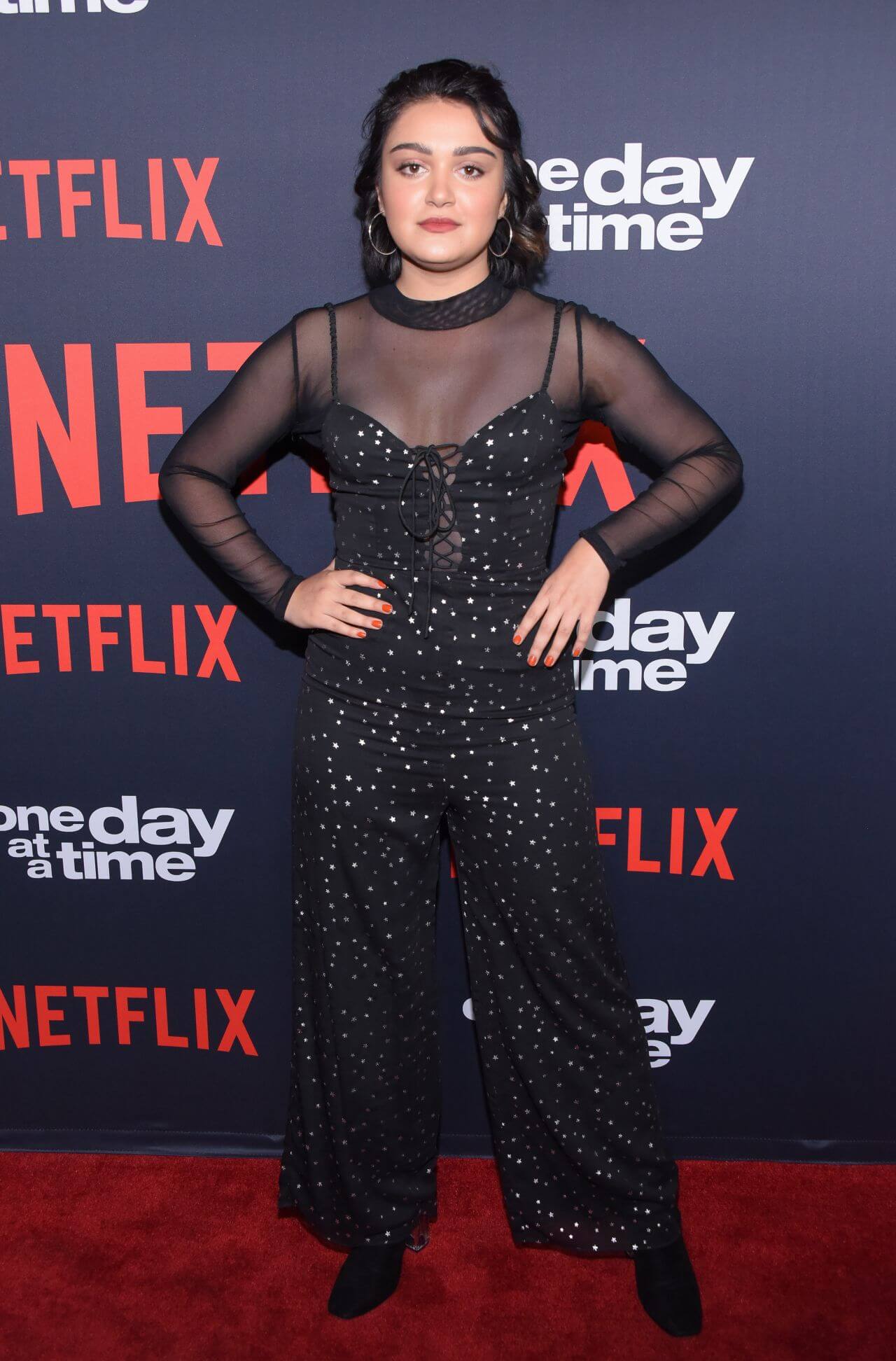 Ariela Barer In Black Sheering Full Sleeves Corset Jumpsuit At “One Day at a Time” TV Show Season 2 Premiere in Los Angeles