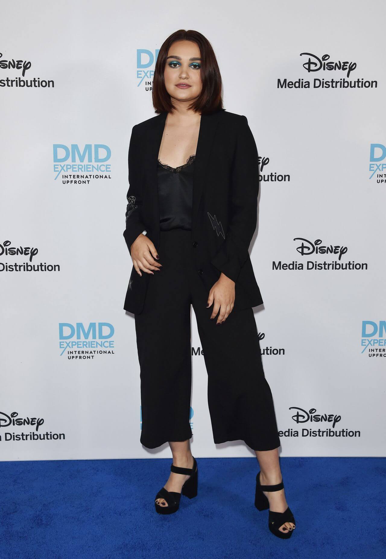 Ariela Barer In Black Top & Flare Pants With Blazer Outfits At Disney ABC International Upfronts in LA
