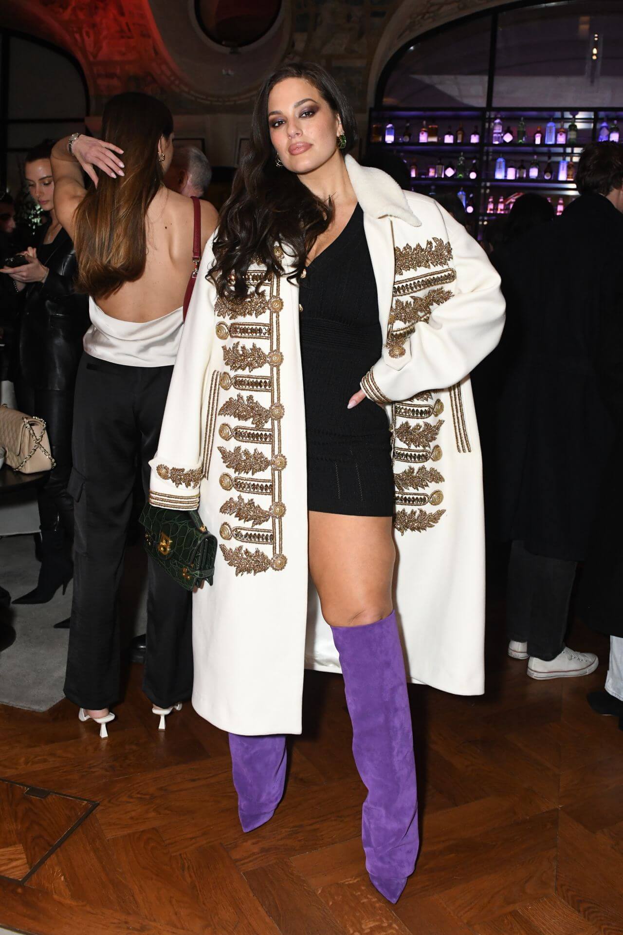 Ashley Graham In Black One Piece With White Heavy Embroidery Long Coat At Harper’s Bazaar France Launch Party in Paris